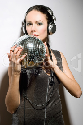 Portrait of nice young brunette in headphones