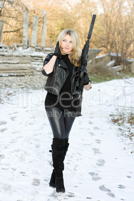 Perfect young woman with a gun