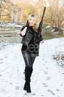 Perfect young woman with a gun