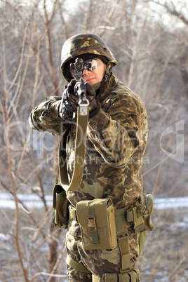 Portrait of soldier with a gun