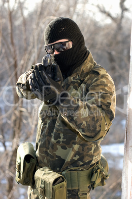 Portrait of soldier with a handgun