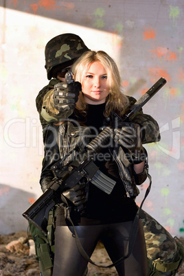 Soldier and girl with a weapon