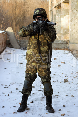 Soldier in camouflage with rifle