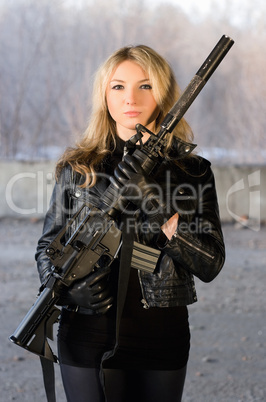 Armed beautiful young woman