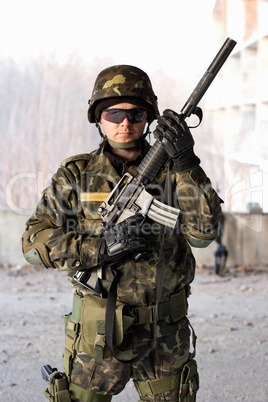 Handsome guy holding a rifle