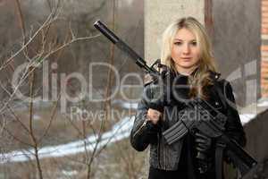 Scared girl with a rifle