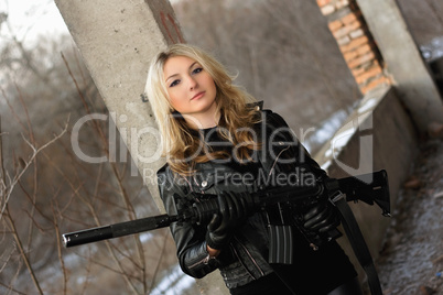 Beautiful young woman with a rifle