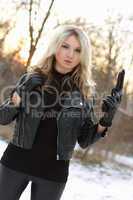 Serious armed woman in winter