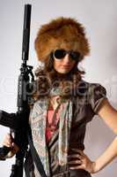 Young stylish woman with a gun