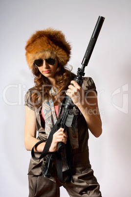 Beautiful armed girl in hat