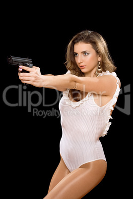 Hot young woman holding a gun