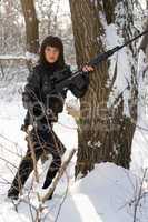 Young woman with a sniper rifle