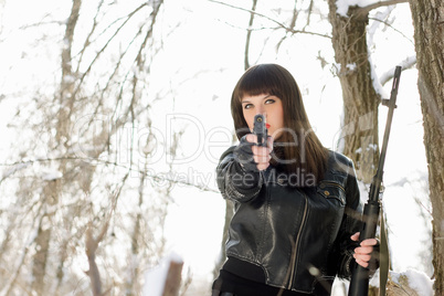 young woman with a pistol