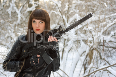 Portrait of young lady with a rifle