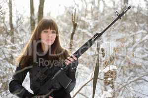 Armed young lady with a gun