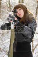 Brunette aiming a gun