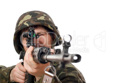 Soldier aiming a rifle