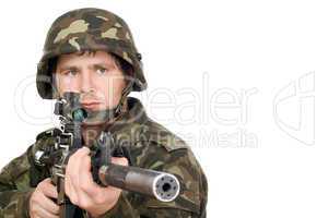Armed soldier pointing m16