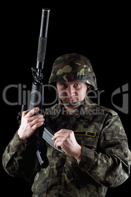 Soldier reloading magazine of m16