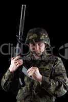 Soldier reloading magazine of m16