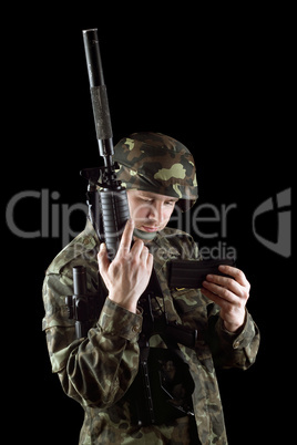 Soldier changing magazine of m16