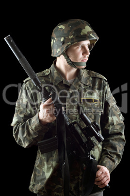 Soldier grasping a gun