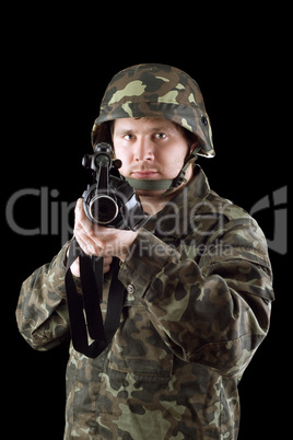 Armed man pointing a rifle