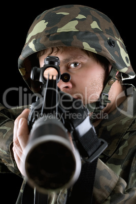 Man pointing a rifle