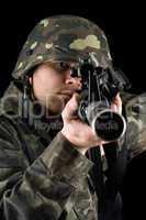 Alerted soldier pointing m16 in studio
