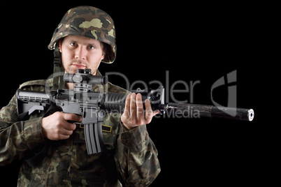 Alerted soldier holding m16