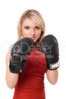 Blond young girl in  boxing gloves