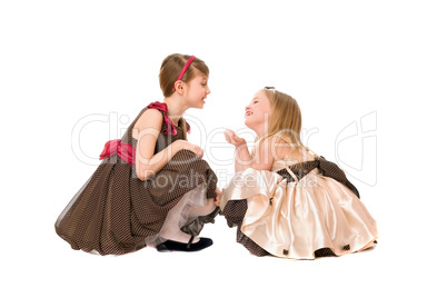 Two beautiful little girls talking