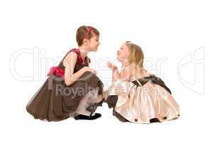 Two beautiful little girls talking