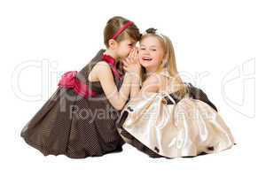 Two little girls talking. Isolated