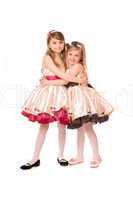 Two attractive little girls in a dress