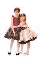 Two cute little girls in a dress. Isolated