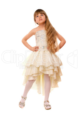 Lovely little girl in a beige dress