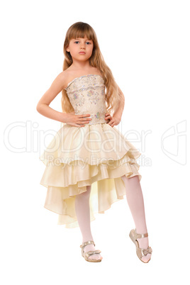 Pretty little girl in a beige dress
