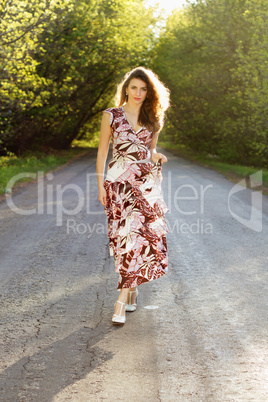 young woman walking on the road