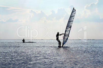 Silhouette of a windsurfer