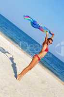 Nice teen girl standing on the beach