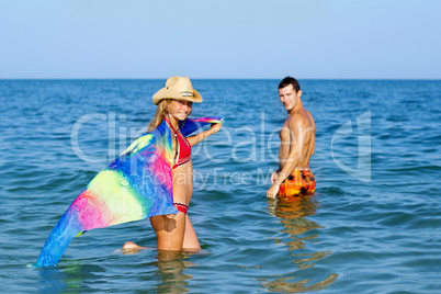 Smiling teen girl and young man