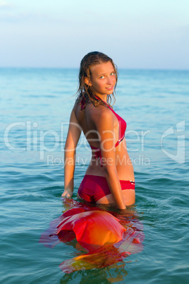 smiling teen girl in the sea