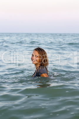 smiling teen girl in the sea