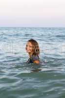 smiling teen girl in the sea