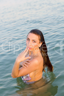 charming wet young woman in the water