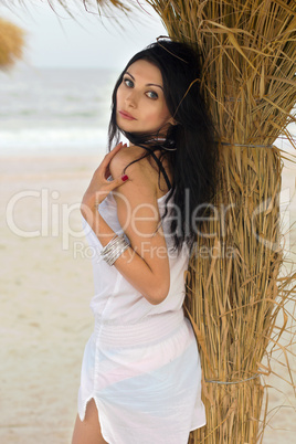 Pretty young brunette on a beach