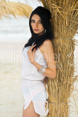 Young brunette on a beach
