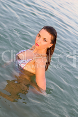 beautiful wet young woman in the water