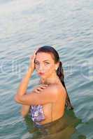 cute wet young woman in the water